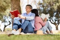 Outdoor Leisure. Portrait Of Relaxed Mature Couple Reading Books In Park Together Royalty Free Stock Photo