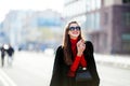 Outdoor lifestyle close up portrait of happy young woman in stylish casual outfit portrait on the street. she smiles and looks at Royalty Free Stock Photo