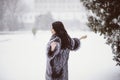 Outdoor lifestyle fashion photo of young natural beautiful lady in winter landscape Royalty Free Stock Photo