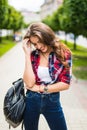 Outdoor lifestyle portrait of amazing glamorous luxury woman posing in city center