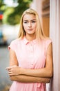 Outdoor lifestyle portrait of amazing glamorous luxury woman posing in city street.