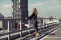 Outdoor lifestyle portrait of pretty young girl, wearing in hipster swag grunge style urban background