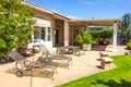 Outdoor Lounge Chairs & Fire Pit At Modern Home Patio Rear Yard