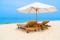 Outdoor lounge chairs on a tropical beach