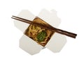 Outdoor lunch box with noodles and vegetables, chopsticks, isolated on white Royalty Free Stock Photo