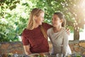 Outdoor, lunch and hug with mother, girl and smile with sunshine and family with healthy meal. Nature, mama and daughter Royalty Free Stock Photo