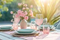 Outdoor lunch table setting with flowers. Romantic table setting with tablecloth, plates, crystal goblets, beautiful Royalty Free Stock Photo