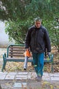 Outdoor manual worker is cleaning the fallen leaves