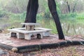 Outdoor marble table set near pond
