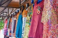 Outdoor market colorful dresses hanging Royalty Free Stock Photo