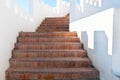 Outdoor Masonry Stairway with White Crenellated Walls at a Luxur Royalty Free Stock Photo