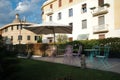 Mediterranean Garden Patio With Tables, Chairs and Umbrella