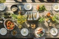 Outdoor midsummer feast with grilled fish, salads, bread, and flowers on a wooden table. Sweden Royalty Free Stock Photo