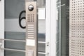 outdoor modern wireless interphone in front of office, intercom to communicate with visitors, stand-alone communication tool, Royalty Free Stock Photo