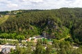 Outdoor natural pool Felsenbad Pottenstein and hill panorama in Franconian Switzerland, Germany