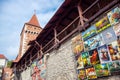 Painting gallery hanging on the wall of St. Florian`s Gate in Krakow, Poland