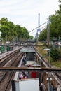 An outdoor Paris metro rail station with a view of the Eiffel Tower Royalty Free Stock Photo