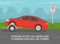 Parking is not allowed and a parked car will be towed. Side view of a car being towed.