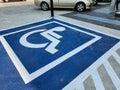 Outdoor parking space for people with disabilities, fairness and equality concept.