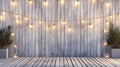 an outdoor party or event with a wooden fence adorned with string lights in the background, and a wooden stage, offering Royalty Free Stock Photo