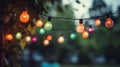 outdoor party string lights hanging in backyard on green bokeh background with copy space Royalty Free Stock Photo