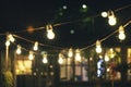 Outdoor party string lights glowing at night