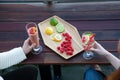 An outdoor patio bar top with a fruit platter, and glass drinks with food-grade, silicone straws Royalty Free Stock Photo