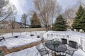 Outdoor patio on a deck of a house with metal chairs and table Royalty Free Stock Photo