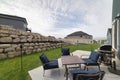 Outdoor patio with lounge chairs and barbecue gas griller