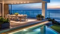 Outdoor patio and small pool in a modern residential building in the evening with lighting and ocean view,