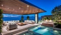 Outdoor patio and small pool in a modern residential building in the evening with lighting and ocean view, Royalty Free Stock Photo