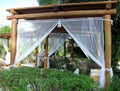 Outdoor pergola curtains. Royalty Free Stock Photo