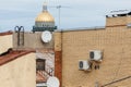 Outdoor photo of two white air conditioners mounted on yellow brick wall Royalty Free Stock Photo