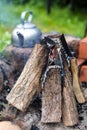 Outdoor picnic kettle with a vintage touch near a bonfire. Cooking outside, campfire cooking.