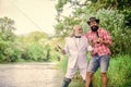 outdoor picnic. summer family weekend. father and son fishing. mature man fisher celebrate retirement. two fishermen