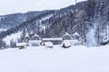 Outdoor picnic table and chairs covered in a thick layer of untouched deep snow. Snow-covered park on the mountains. Royalty Free Stock Photo