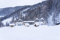 Outdoor picnic table and chairs covered in a thick layer of untouched deep snow. Snow-covered park on the mountains. Royalty Free Stock Photo