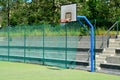 Outdoor playground for ball games. high barriers fencing protect spectators on a concrete tribune in the shape of stairs. Amphiree