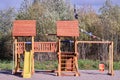 Outdoor playset for toddlers and kids made of wood and plastic.