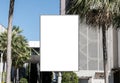 Outdoor pole vertical billboard with mock up white screen. Clipping path for mockup