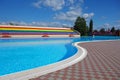 Outdoor pool with water attractions and blu sky