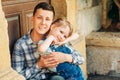 Outdoor portrait of adorable little girl with teenage brother Royalty Free Stock Photo