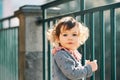 Outdoor portrait of adorable toddler girl with curly hair Royalty Free Stock Photo