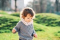 Outdoor portrait of adorable toddler girl with curly hair Royalty Free Stock Photo