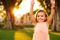 Outdoor portrait of adorable 3 or 4 year old girl playing in summer park Royalty Free Stock Photo