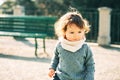 Outdoor portrait of adorable toddler girl with curly hair Royalty Free Stock Photo