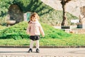 Outdoor portrait of adorable toddler girl with curly hair Royalty Free Stock Photo