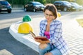 Outdoor portrait of an adult beautiful woman reading a book whil Royalty Free Stock Photo