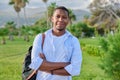 Outdoor portrait of African American man with crossed arms looking at camera. Royalty Free Stock Photo