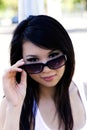 Outdoor Portrait Asian American Woman Looking Over Sunglasses Royalty Free Stock Photo